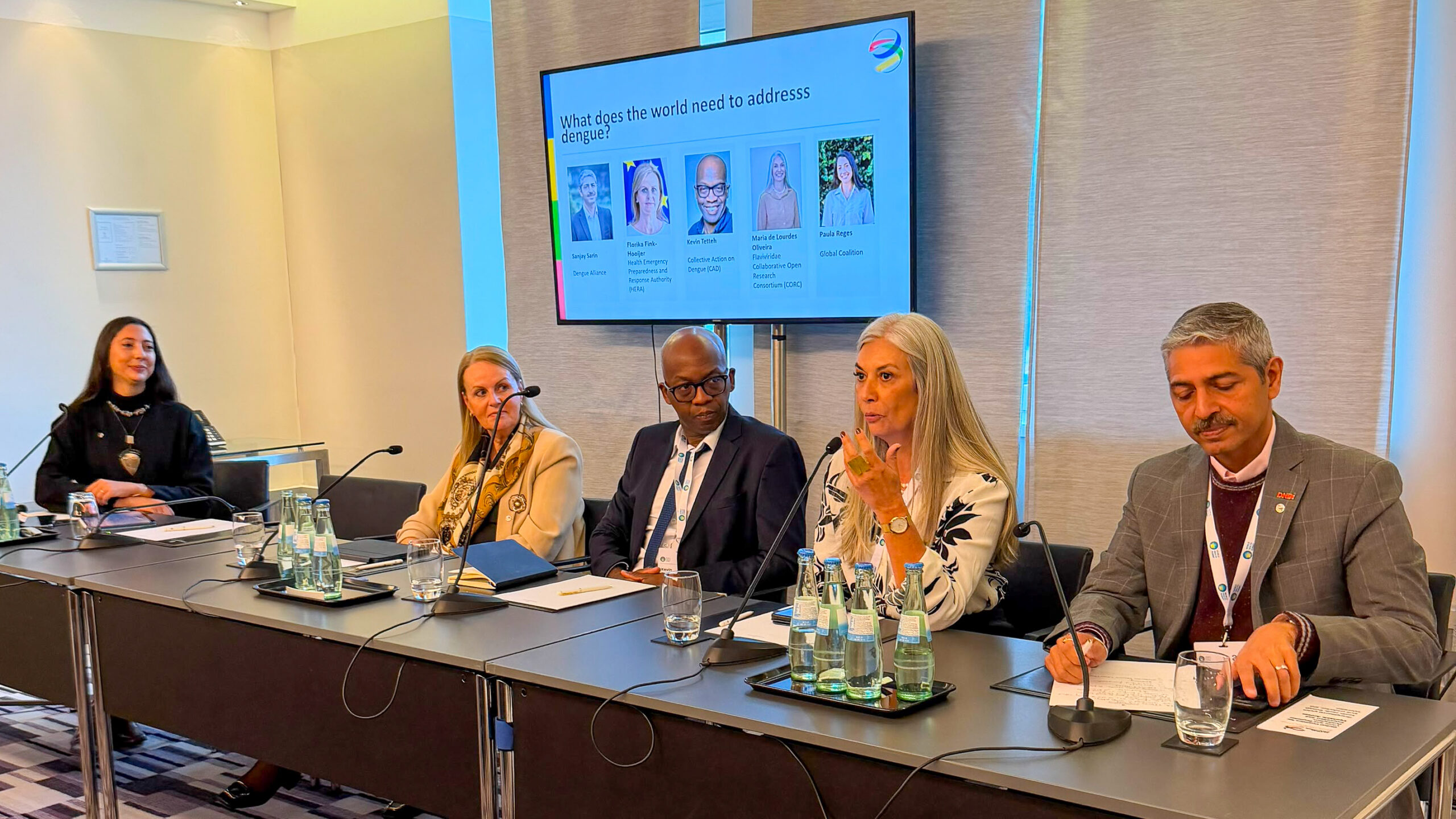 From left to right: Paula Reges (Global Coalition), moderator; Florika Fink-Hooijer (HERA); Kevin Tetteh (FIND/CAD); Maria de Lourdes Aguiar Oliveira (Fiocruz/CORC); and Sanjay Sarin (Dengue Alliance), during a panel discussion on dengue innovation and equitable access at the World Health Summit 2026 in Berlin. Photo: The Global Coalition.
